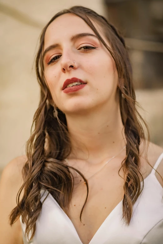 a woman with wet hair is posing for a po