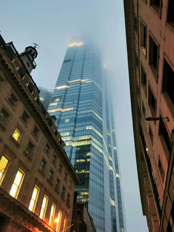 the glass building towering over the city streets