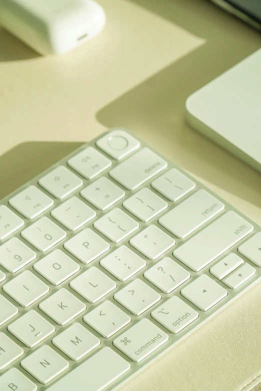 a view of a computer keyboard, mouse, and mac book