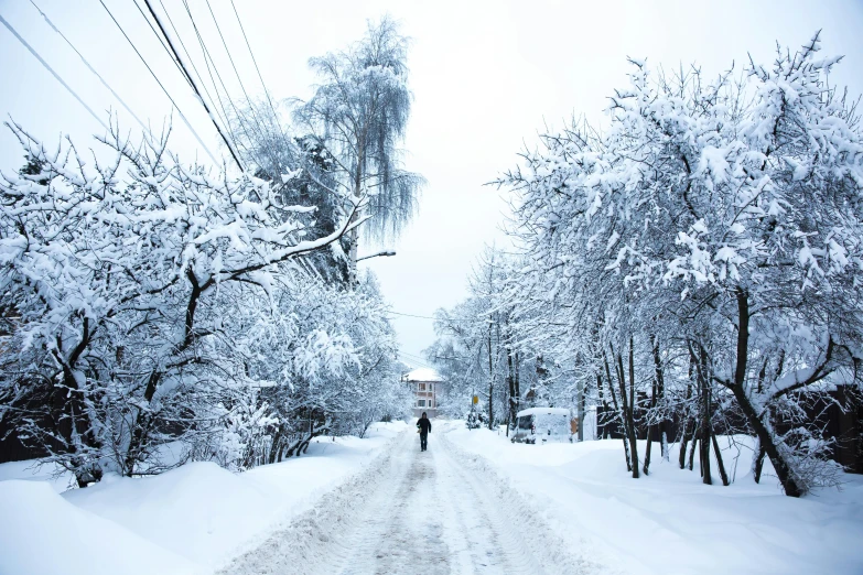 a person that is standing in the snow