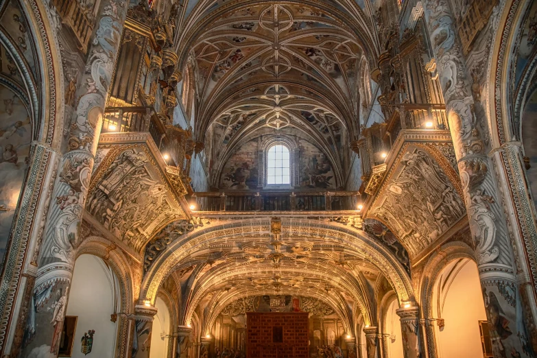 the interior of a cathedral with intricate carvings