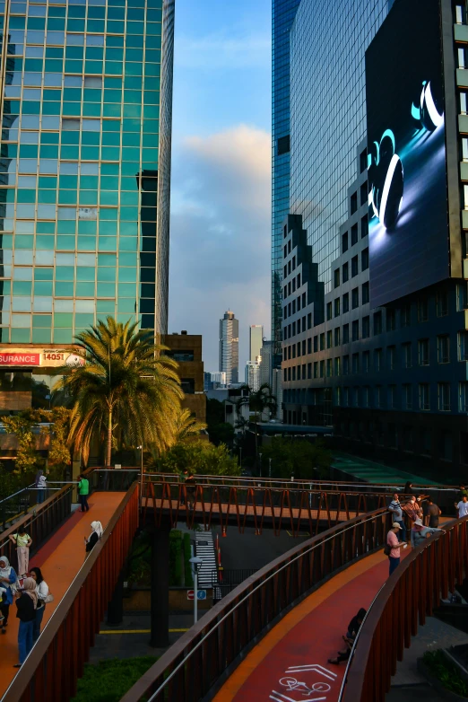 some buildings and a hill with people on the top