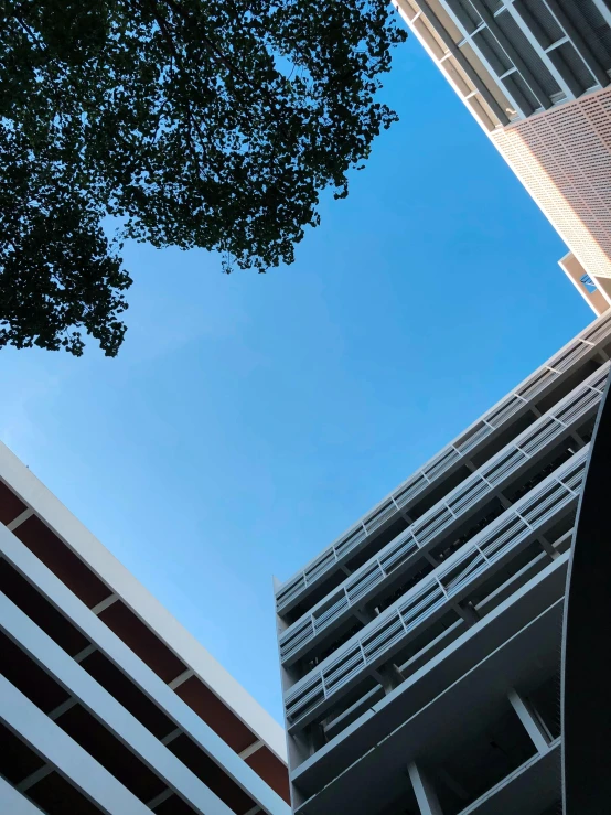 two large buildings that look like they are flying through the air