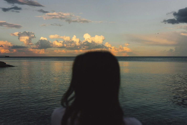 a view over the water with a person standing on top