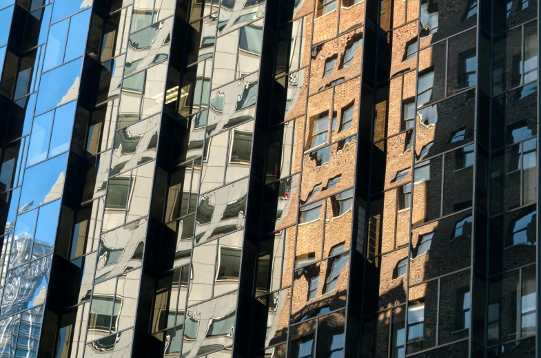 the reflections in the glass windows of an old building