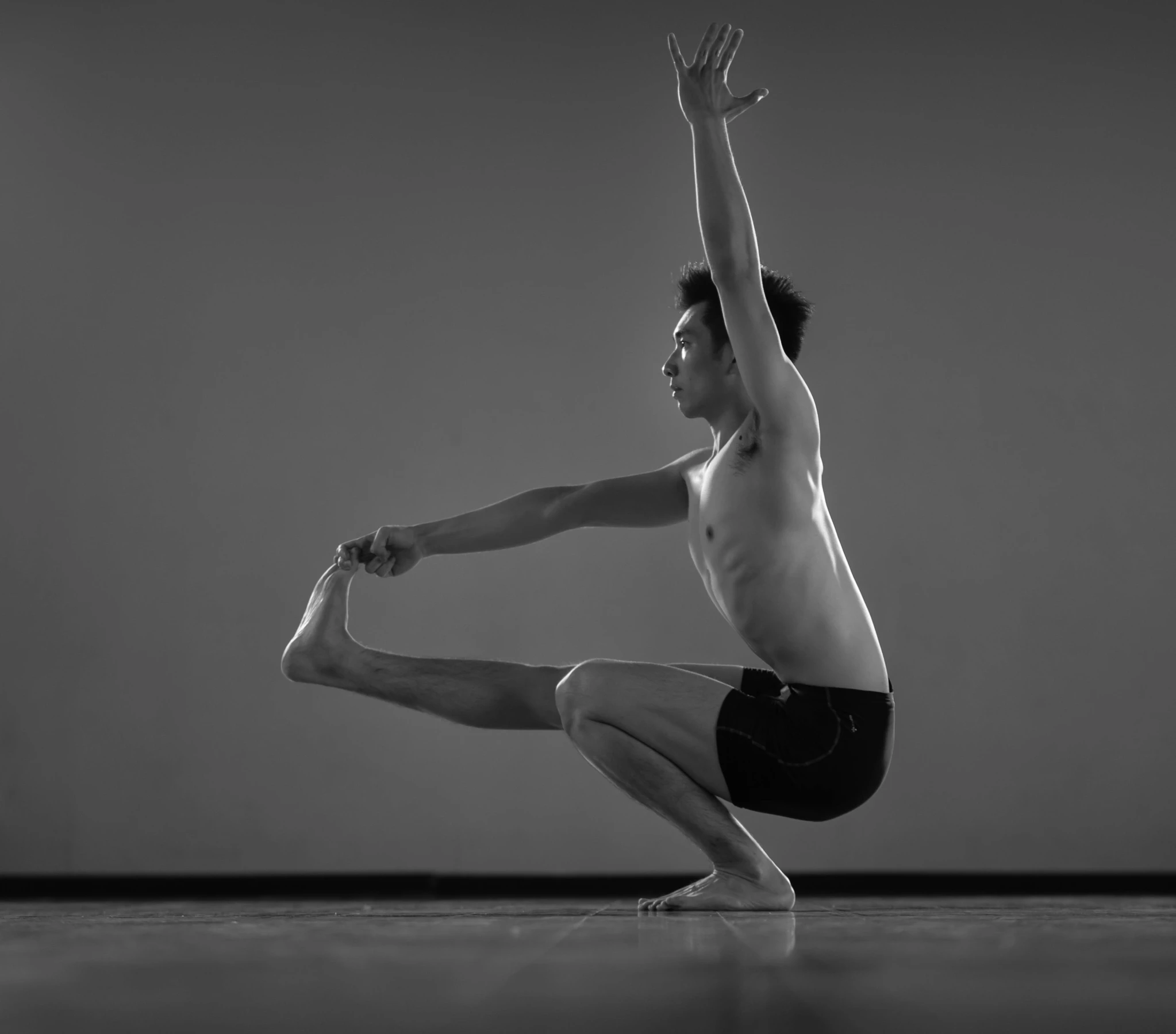 a man that is in the air with a yoga mat