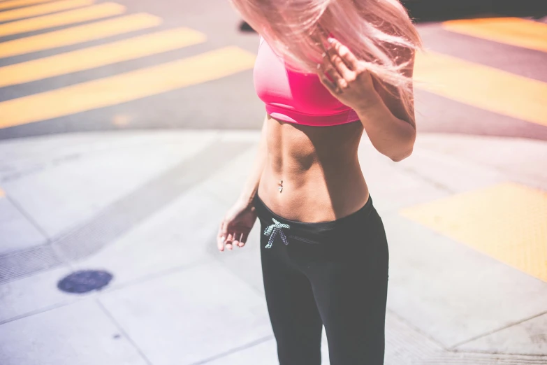 a woman is holding her hands in front of her chest