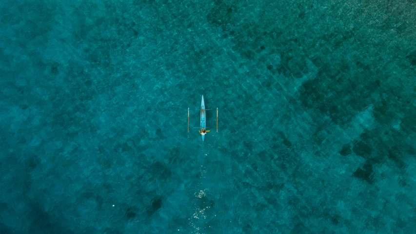 an airplane that is flying over some water