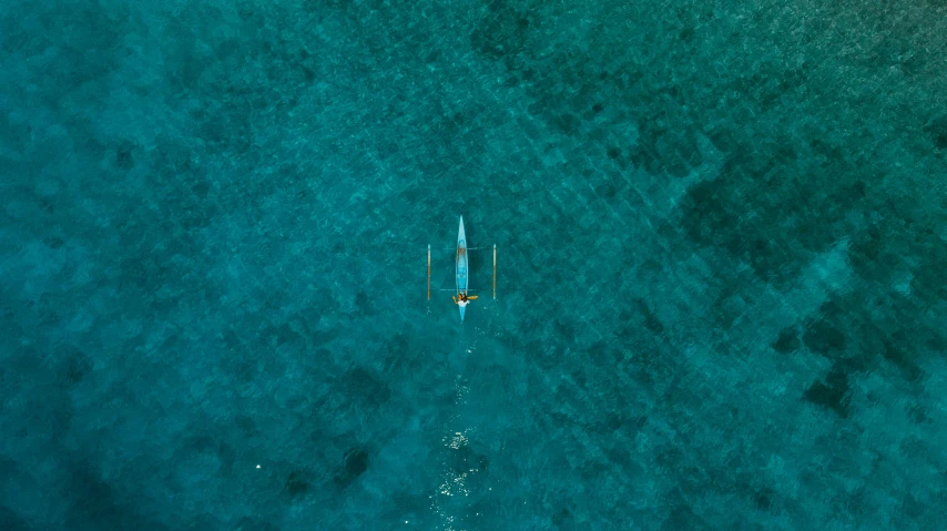 an airplane that is flying over some water