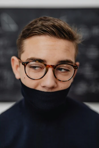 a man with a turtle neck, glasses and turtle - neck sweater