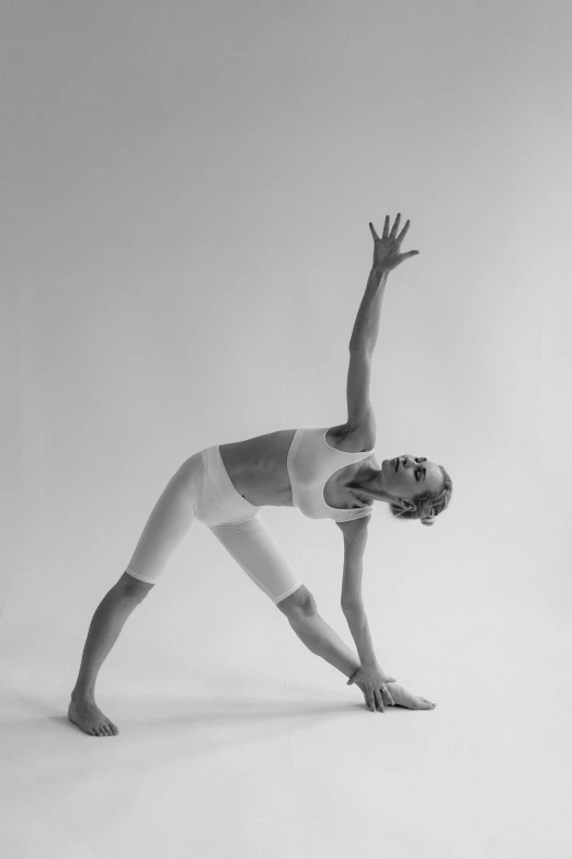 a young woman is practicing her acrobatic moves