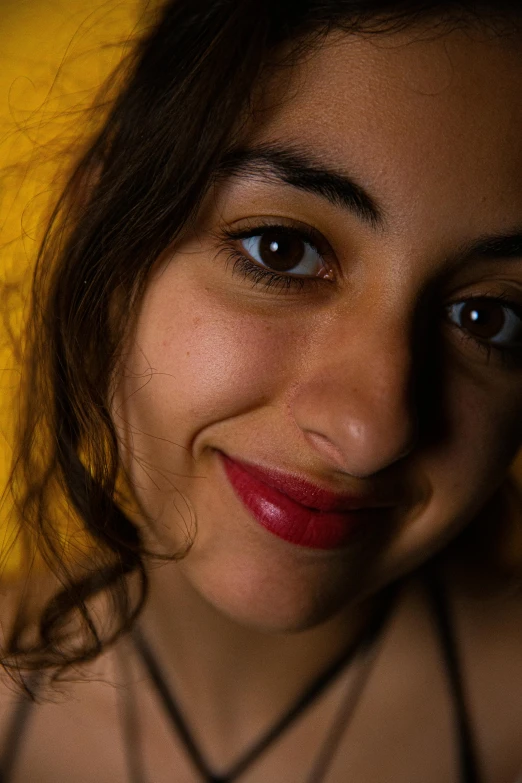 this is a beautiful young woman wearing necklaces