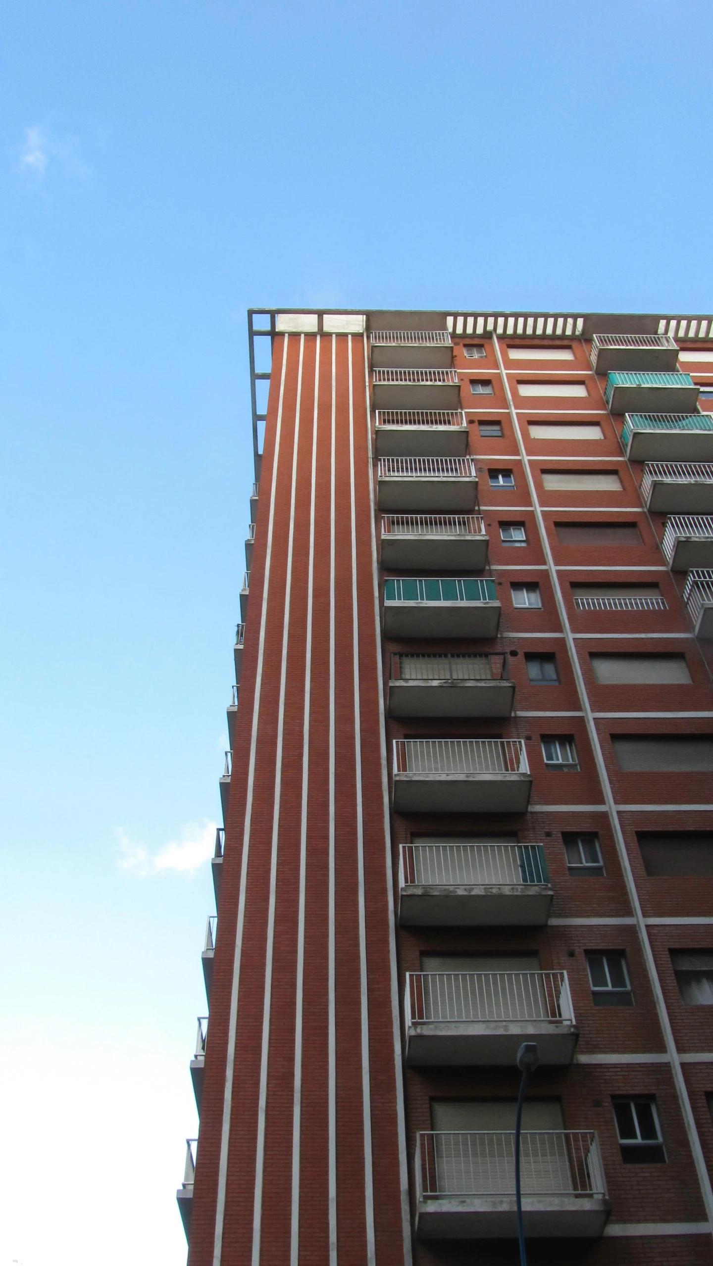 a brick building with balcony and balconies