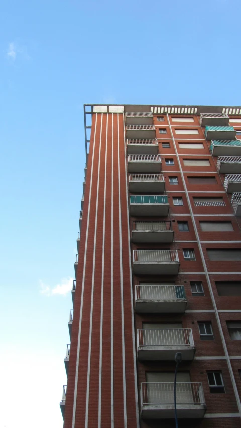 a brick building with balcony and balconies