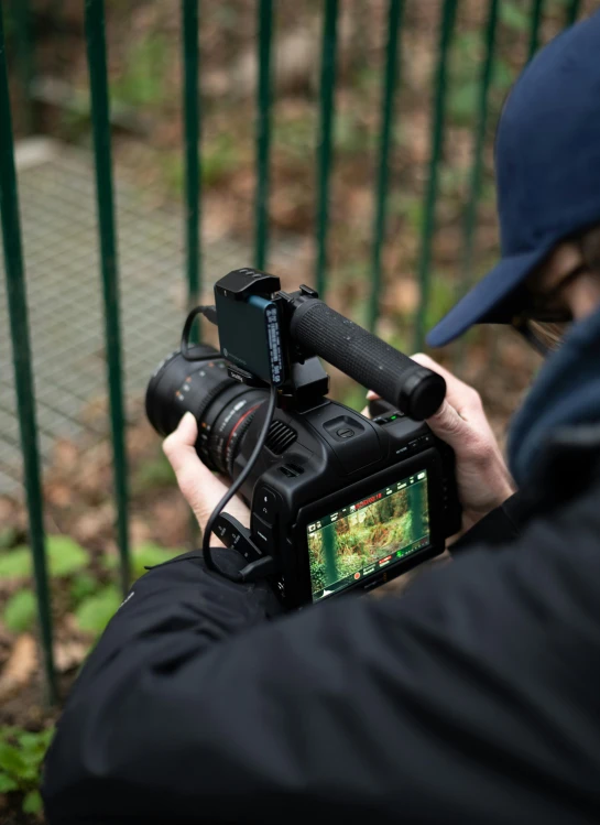 a person in the rain holding a camera