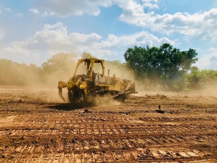 a compact sized vehicle moving through a field