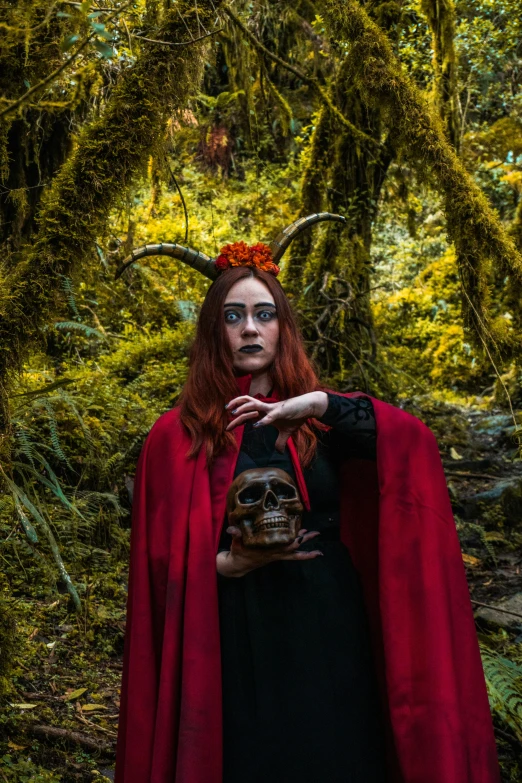 a woman dressed up in red wearing a black dress