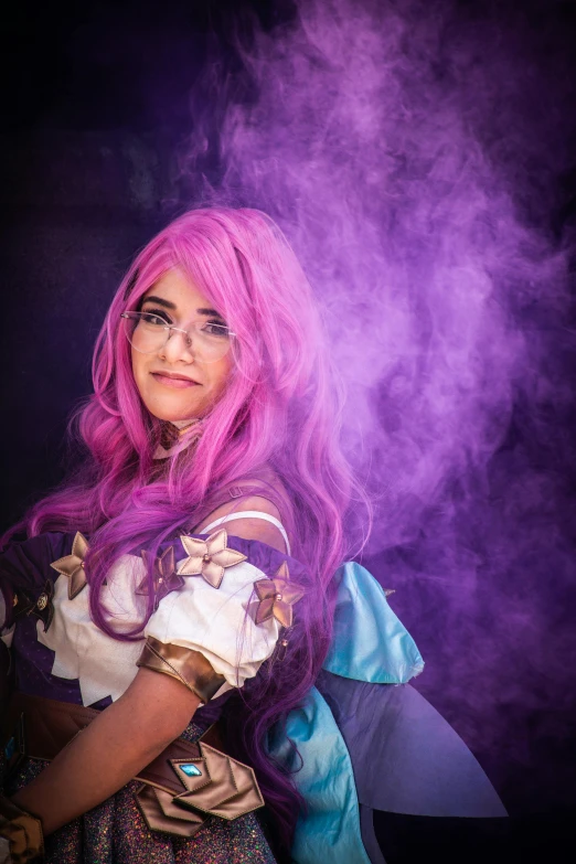 a woman in a cosplay with pink hair and purple smoke in the background