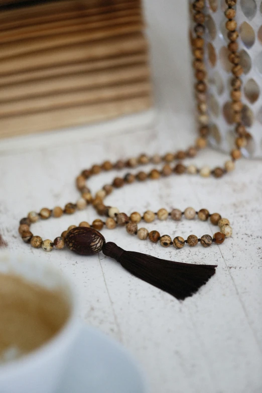 a rosary sitting on top of a white counter top