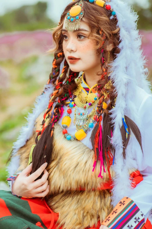 woman in white feathers with brown and red colors