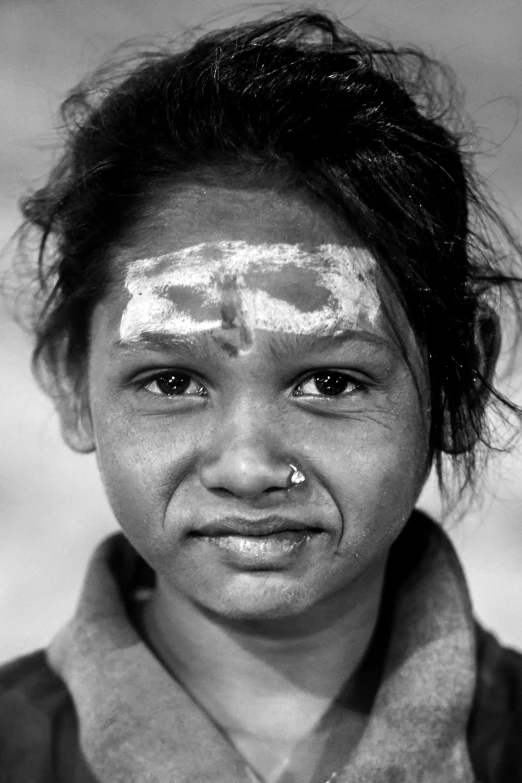 a woman with the word war painted on her face