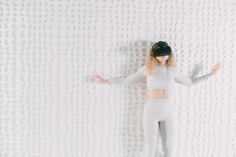 a woman standing in front of a wall with bubbles