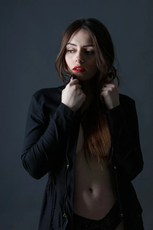 a woman wearing black clothing is posing for a po