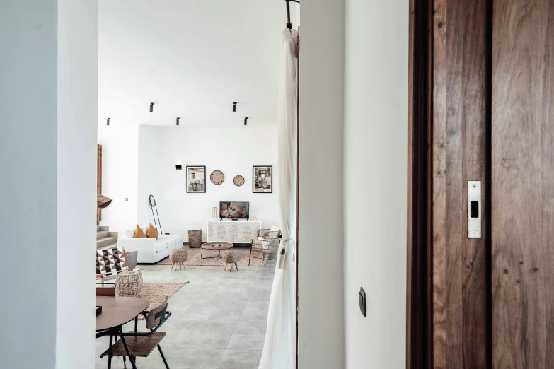 the hallway in this white home is very narrow