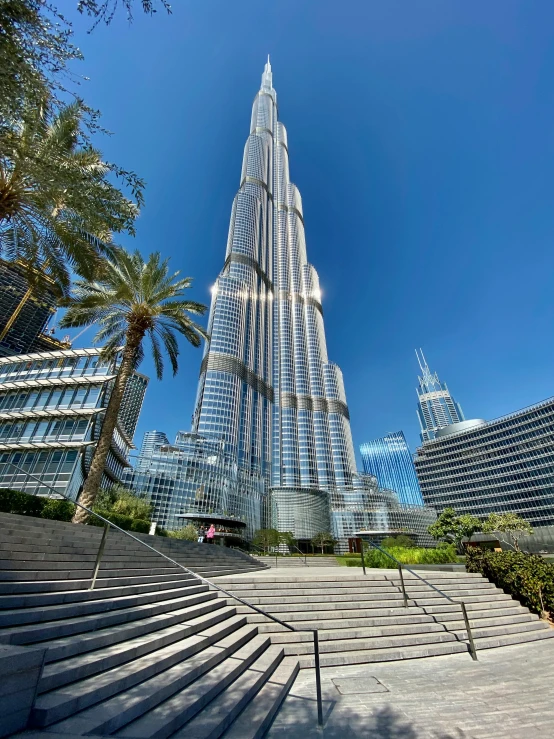 a very tall building that has stairs leading to it