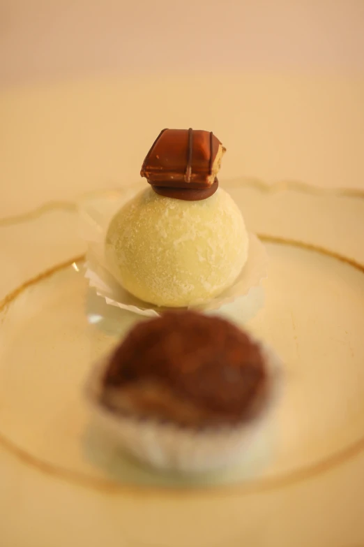 two dessert items sitting on top of a plate