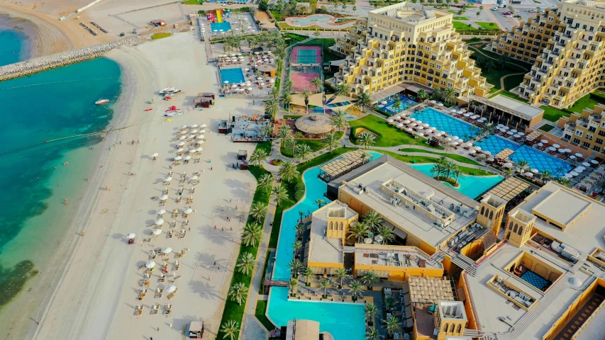 an aerial view of a resort, a el and beach