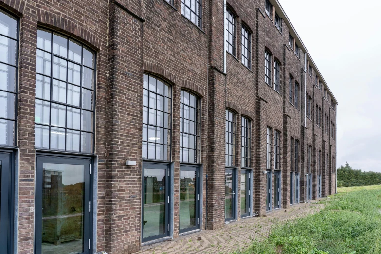 an old brick building with several windows on it