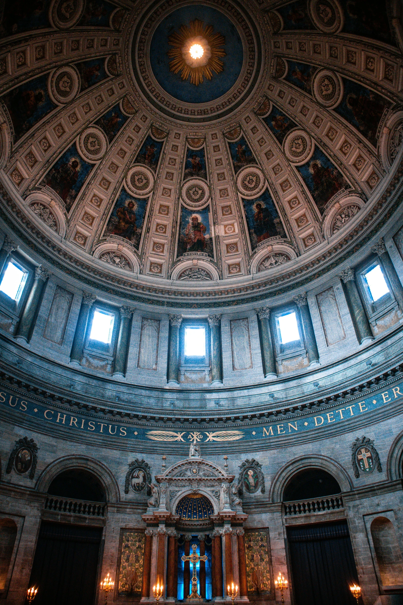 the interior of the dome has paintings and windows