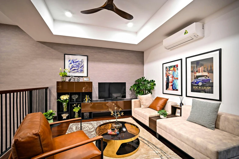 a living room with a ceiling fan, sofa, chairs and various artwork on the walls