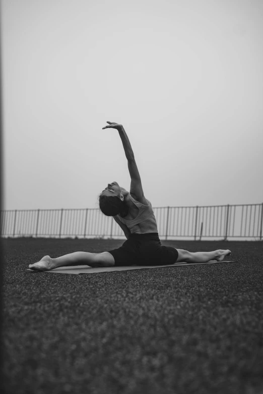 a woman is doing the splits in a yoga pose