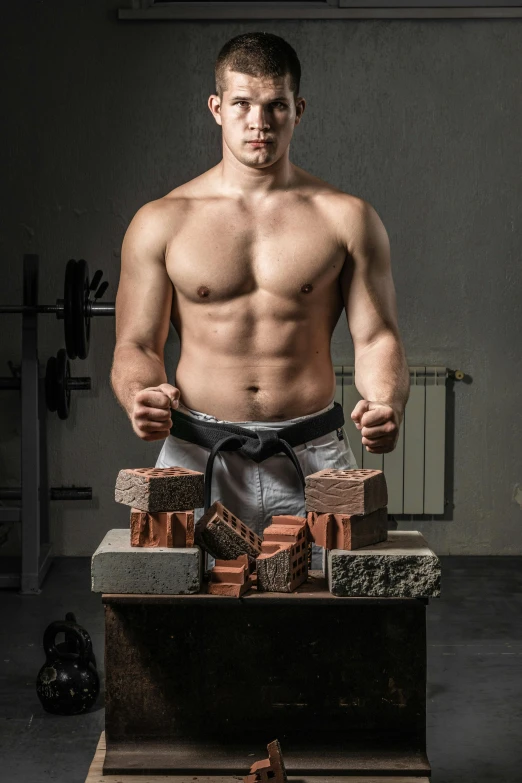 a man with  is standing by a board