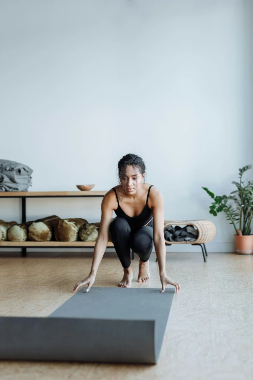 woman standing on one leg with legs crossed and stretching