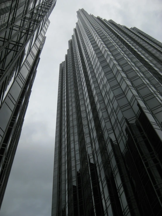 tall skyscrs that have many windows and glass on them