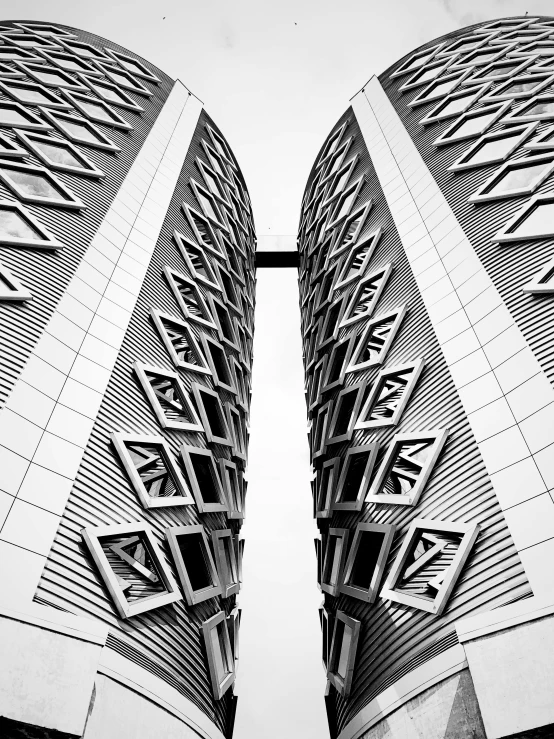 looking up at two buildings on the top of a hill