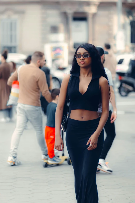 a woman wearing sunglasses and a black top