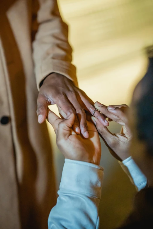 a woman and a child hold their hands