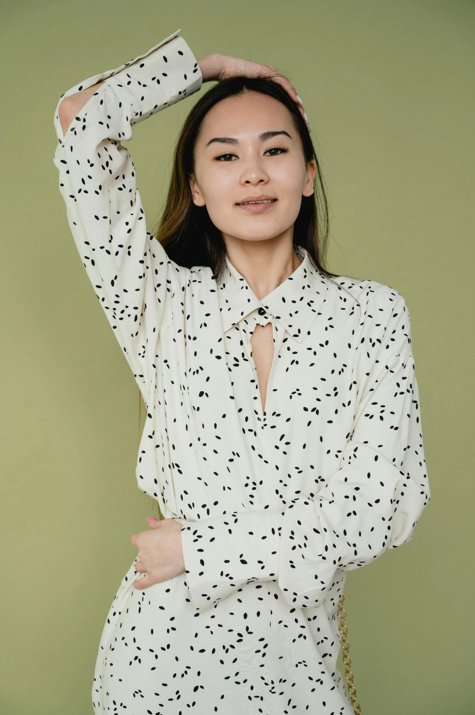 a young lady wearing white polka dotted clothes