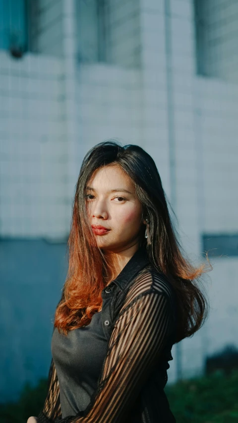 a woman in a black dress and brown hair