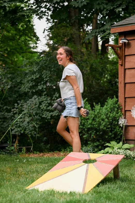 a person with  on stands on a colorful object