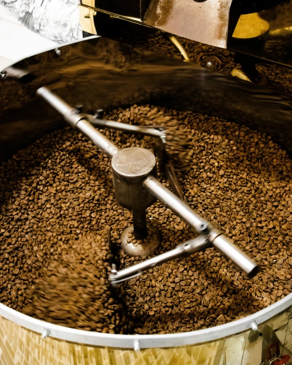 an antique coffee grinder sits in a coffee grinder