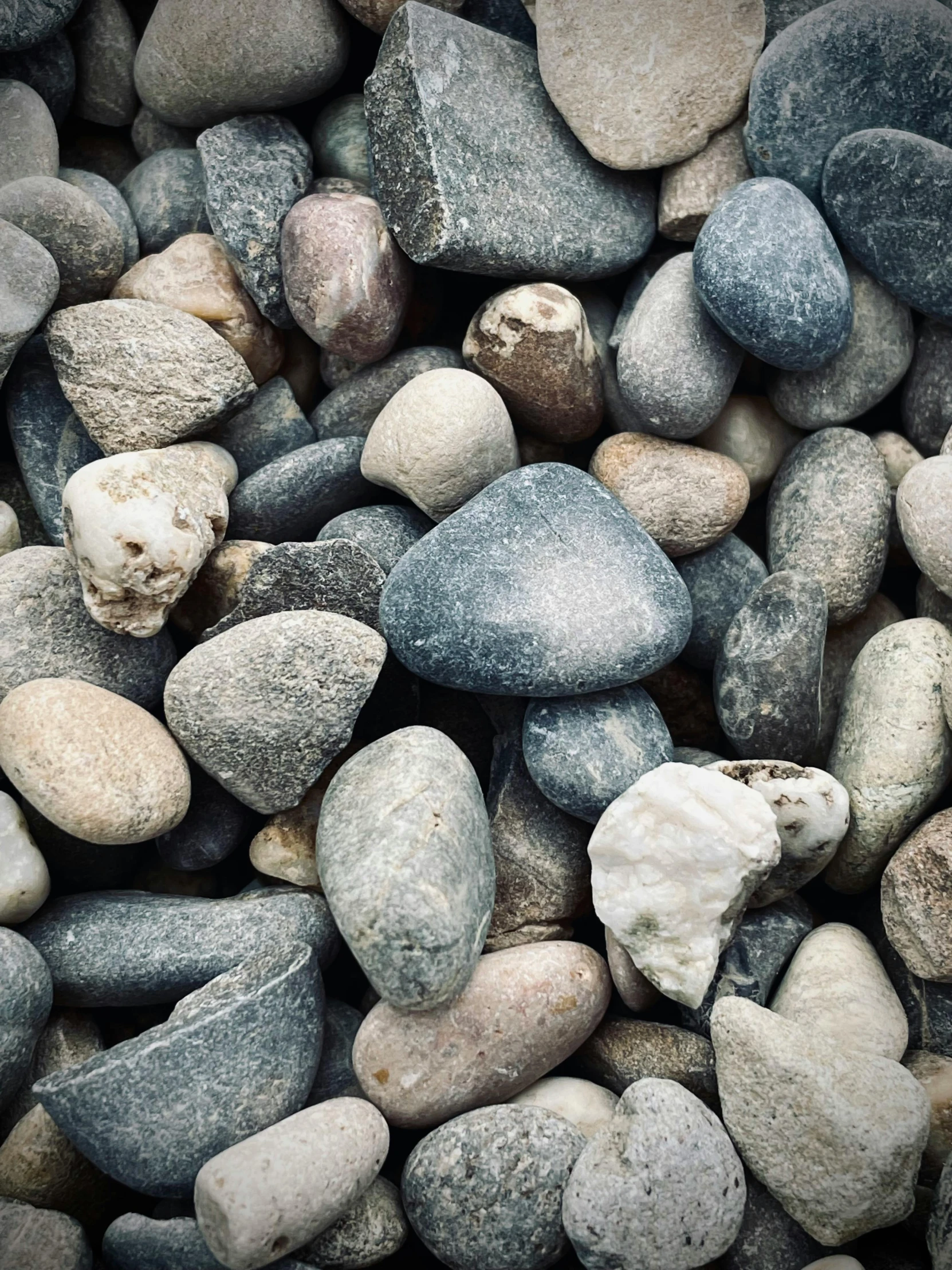 many different color and size rocks together