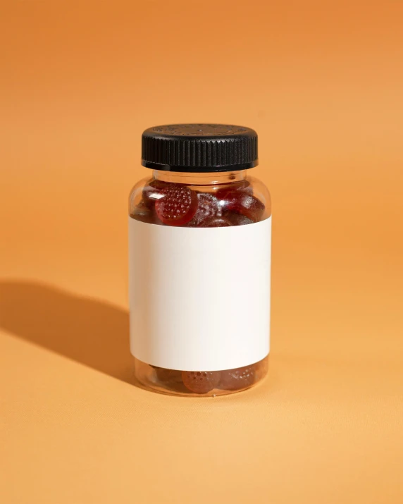 a jar of jam sitting on a yellow table