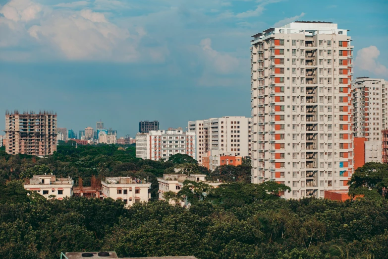 several white and red buildings with the trees near by