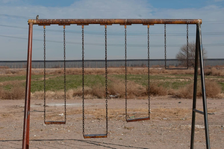 an old rusty and metal playground equipment is broken