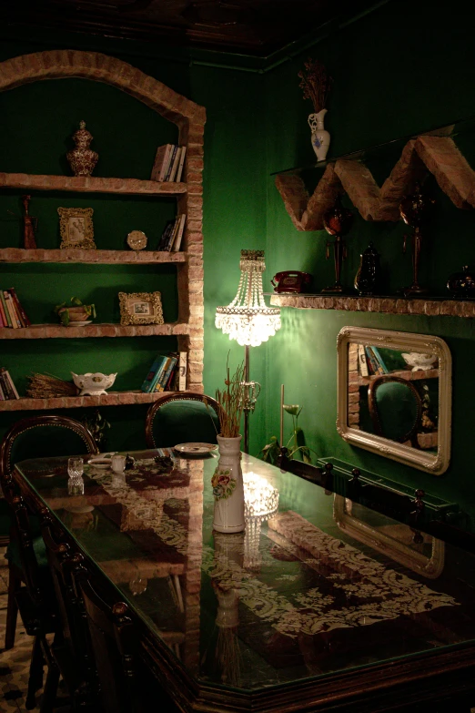 green room with table and chairs and a mirror